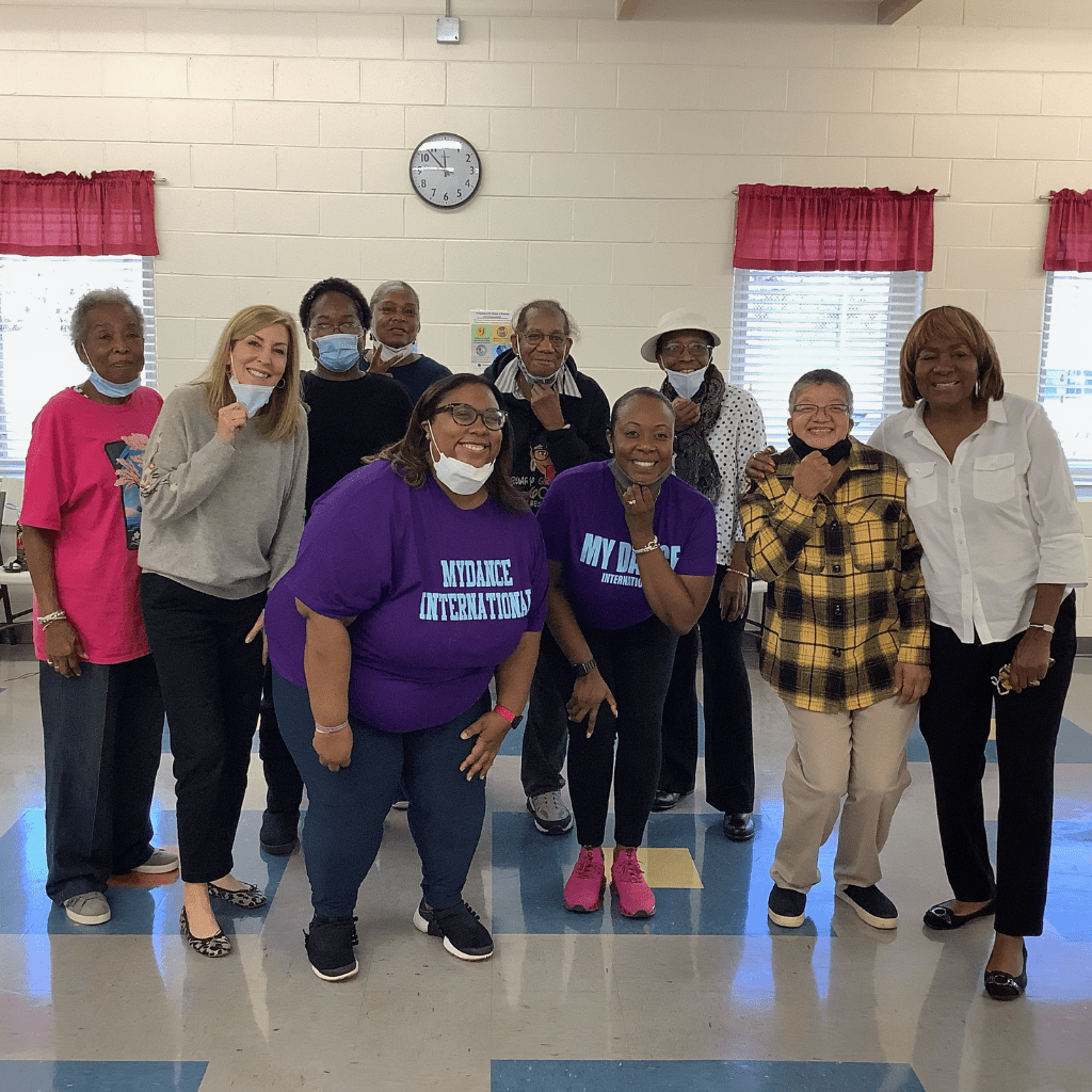 Leigh with group of attendees after Medicare education event