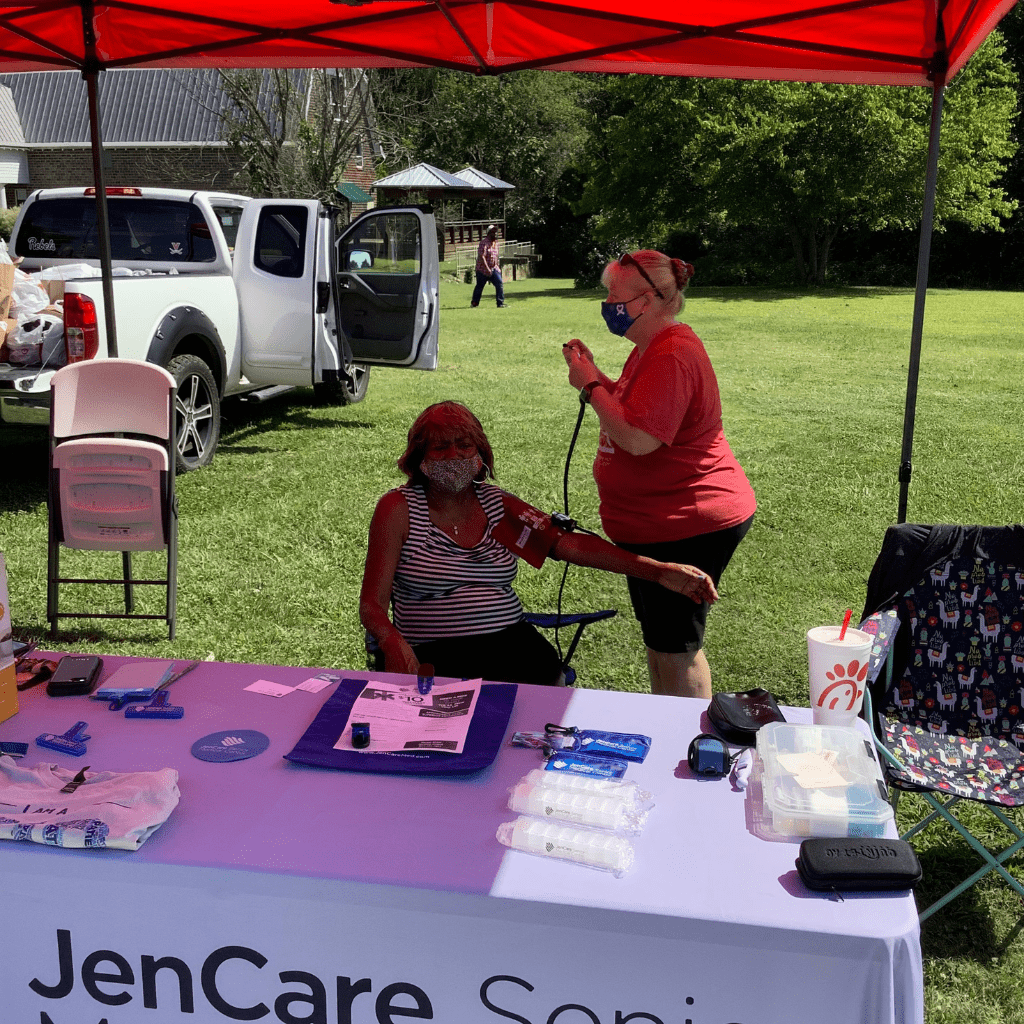 Leigh at a local hospital event fair getting a blood pressure check done