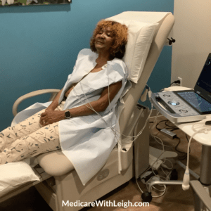 Photo of Leigh Battle in an exam room receiving an echocardiogram heart test as part of a preventive care schedule.